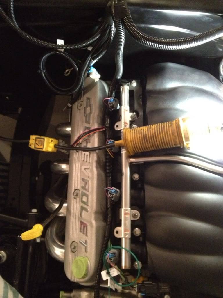 Where did you make the firewall penetration for the grommet and what size hole? Pictures if available. I don't want to screw this up since the motor is in ...